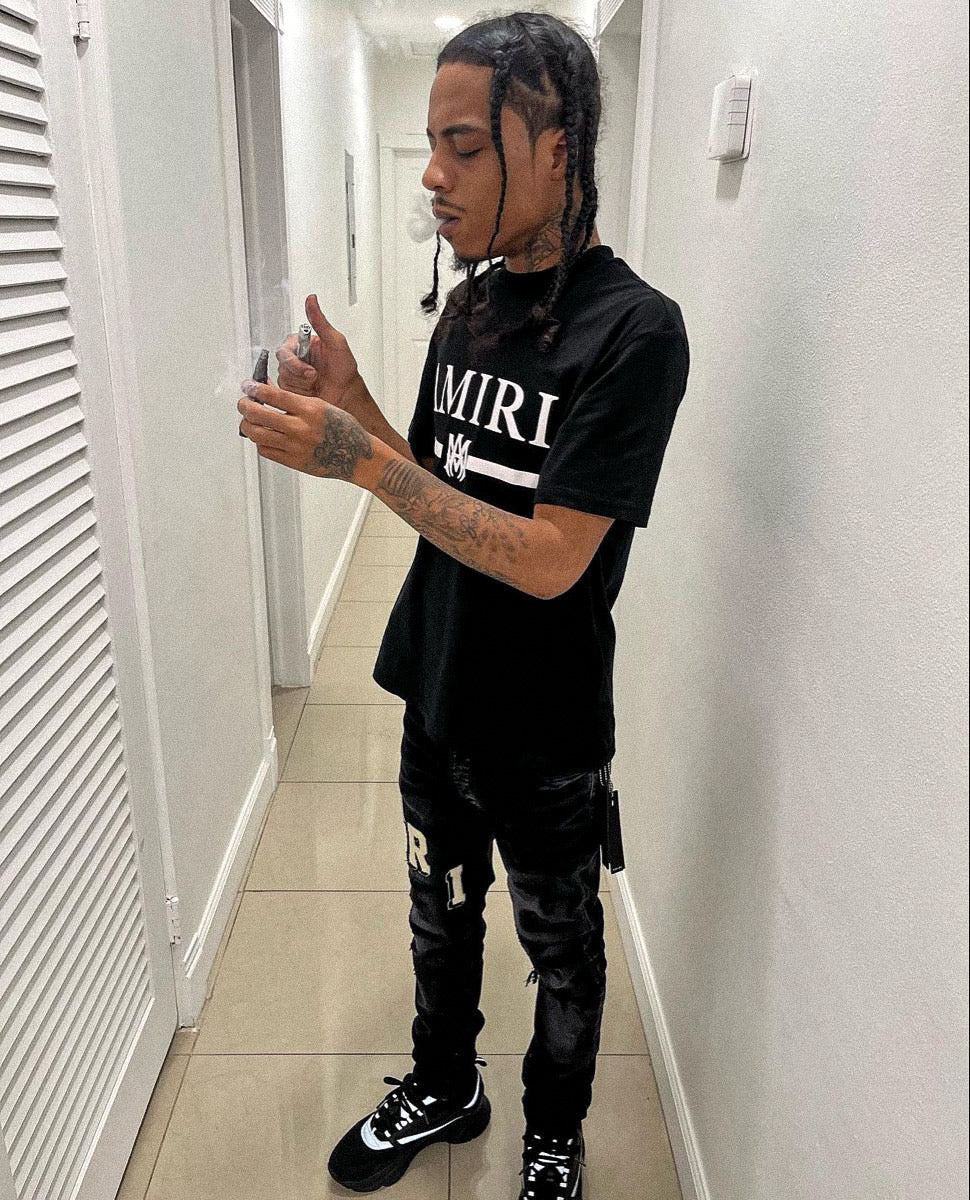 Jean délavé à logo blanc Amr