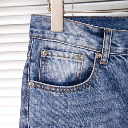 JEANS EN DENIM À ÉCUSSONS CROIX NOIRS CHROMÉS