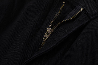 Jean noir à écusson croix bleue et cœurs chromés