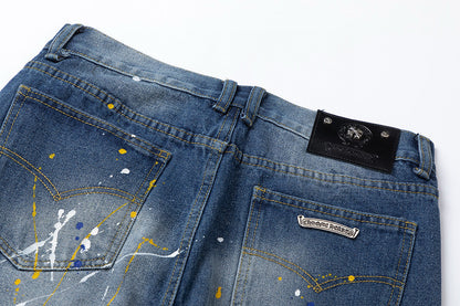 JEANS EN DENIM À CŒURS CHROMÉS ET CROIX VERTES