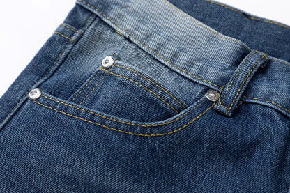 JEANS EN DENIM À CŒURS CHROMÉS ET CROIX VERTES