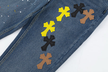 JEANS EN DENIM À PATINS CROISÉS ET CŒURS CHROMÉS