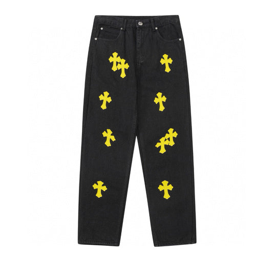 Jean noir à motif cœurs chromés et croix jaune