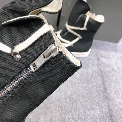 Baskets montantes en toile noire avec lacets enveloppants