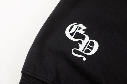 Sweat-shirt noir avec logo de chaussure à cheval et croix chromée.