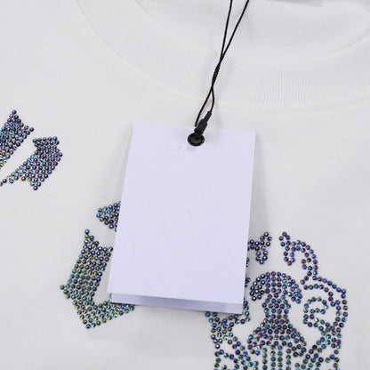 T-SHIRT BLANC À MOTIFS DE CŒURS CHROMÉS ET PAILLETTES