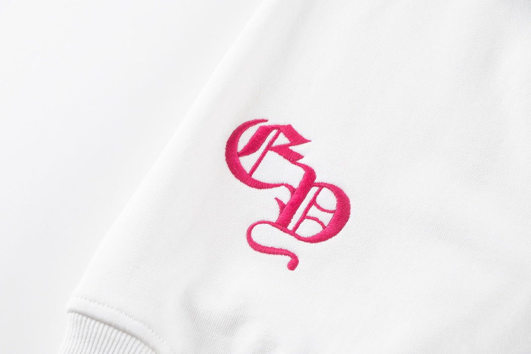 Sweat-shirt blanc avec logo de fer à cheval rose et cœurs chromés