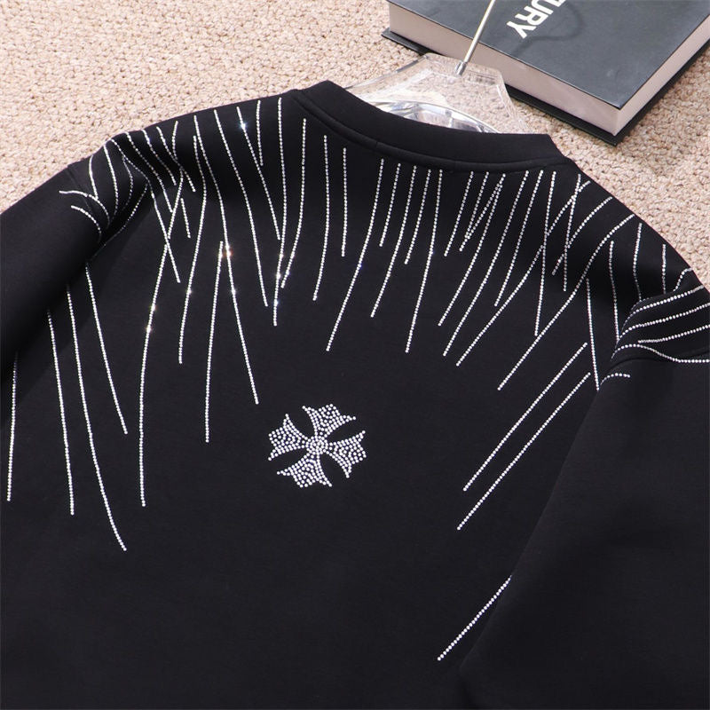 Sweat-shirt noir à motif cœurs chromés et strass