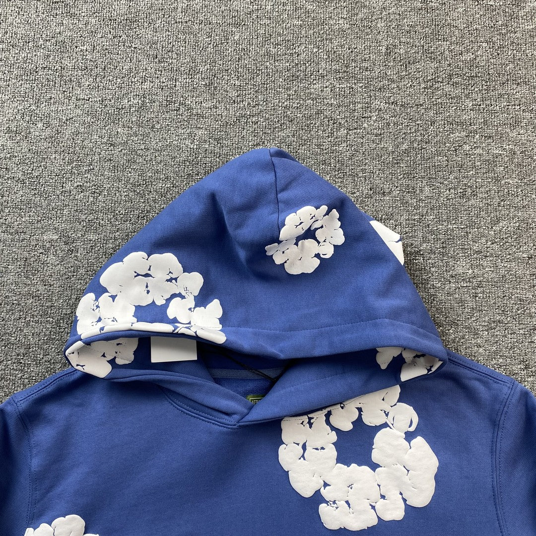 Sweat à capuche bleu en coton avec motif de déchirures de denim