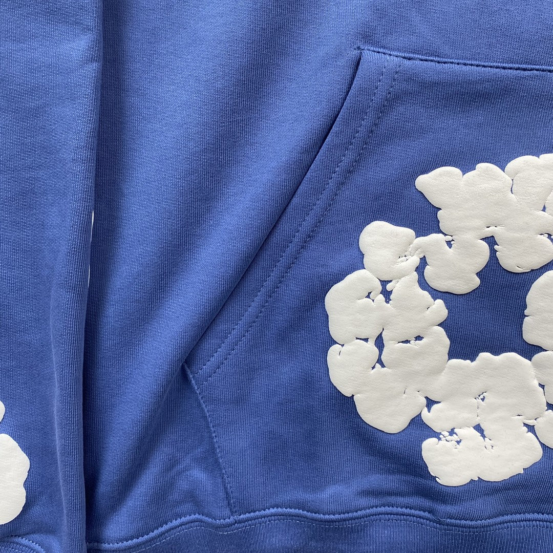 Sweat à capuche bleu en coton avec motif de déchirures de denim