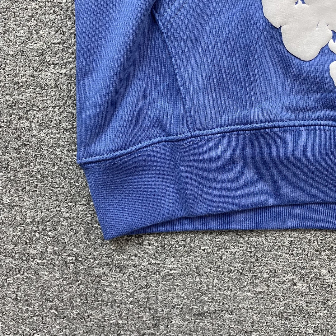 Sweat à capuche bleu en coton avec motif de déchirures de denim