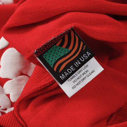 Sweat à capuche rouge en coton avec motif de déchirures de denim