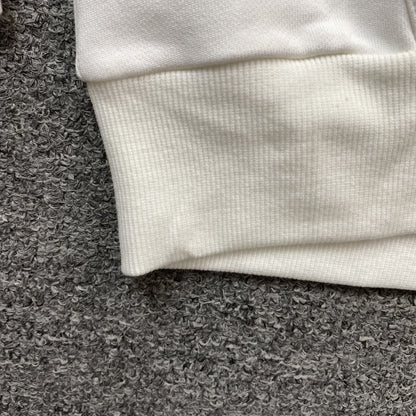 Sweat à capuche blanc en coton avec motif de déchirures de denim