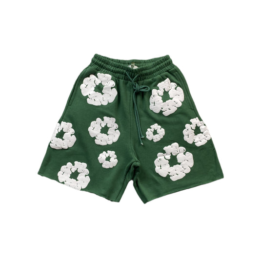 Short vert en coton avec déchirures de denim