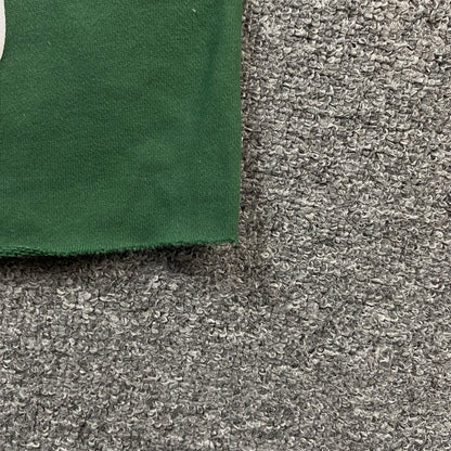 Short vert en coton avec déchirures de denim