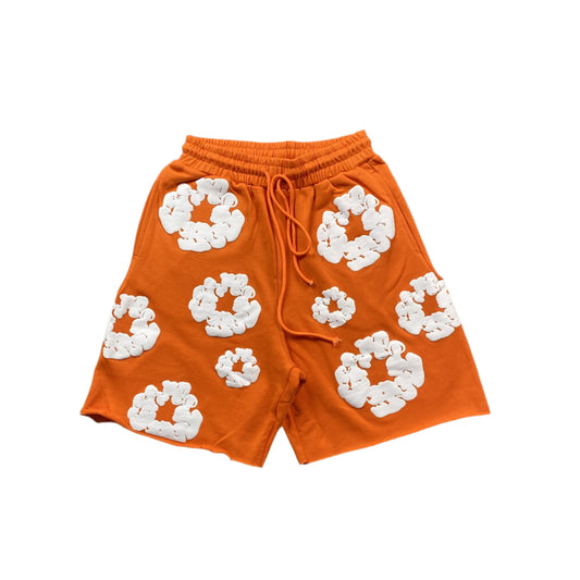 Short en coton orange à motif de déchirures de denim