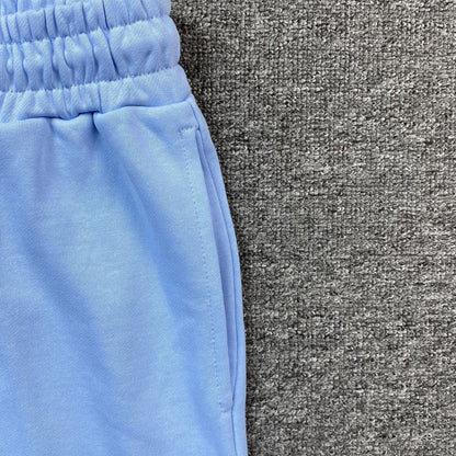 Pantalon de survêtement bleu clair à motif de couronne en coton et denim déchiré