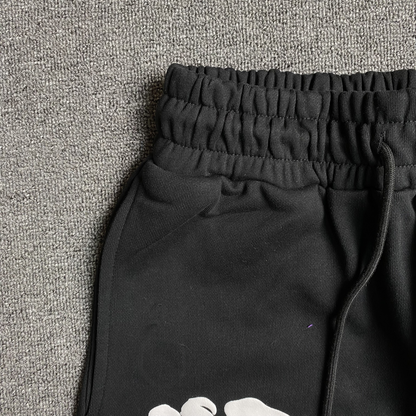 Pantalon de survêtement noir en coton déchiré et couronne