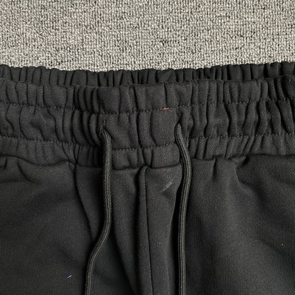 Pantalon de survêtement noir en coton déchiré et couronne