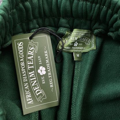 PANTALON DE SURVÊTEMENT EN COTON À MOTIFS DÉCHIRÉS VERT FONCÉ