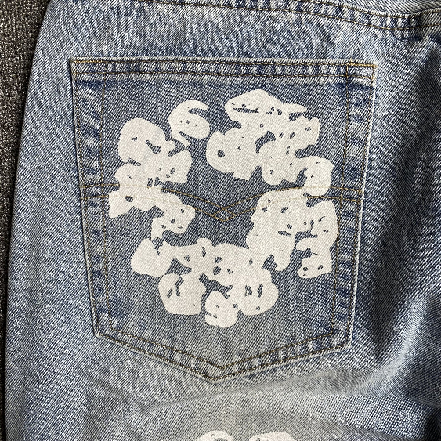DENIM TEARS x LEVI'S COTTON WREATH JEANS DÉLAVAGE LÉGER