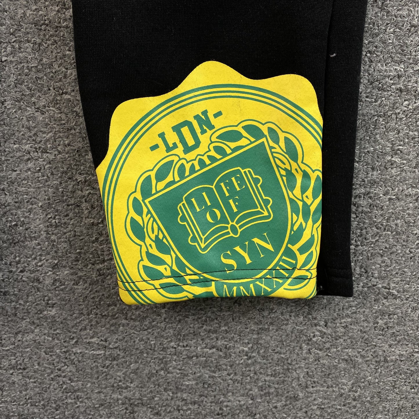 Pantalon de survêtement noir SYNA WORLD COLLEGE 