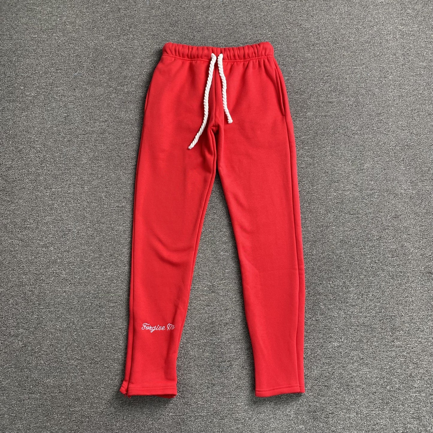 Pantalon de survêtement rouge SYNA WORLD avec logo SYNA