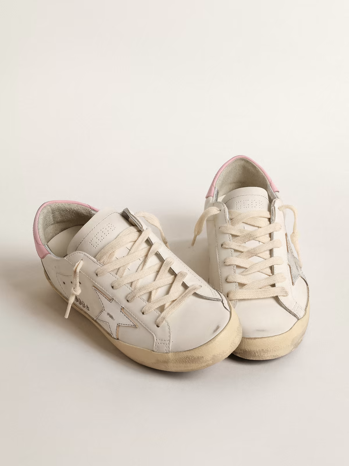Baskets Golden Goose Super-Star blanches et roses