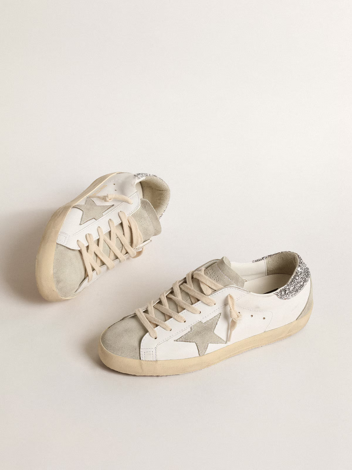 Golden Goose Superstar – Cuir blanc avec talon à paillettes argentées