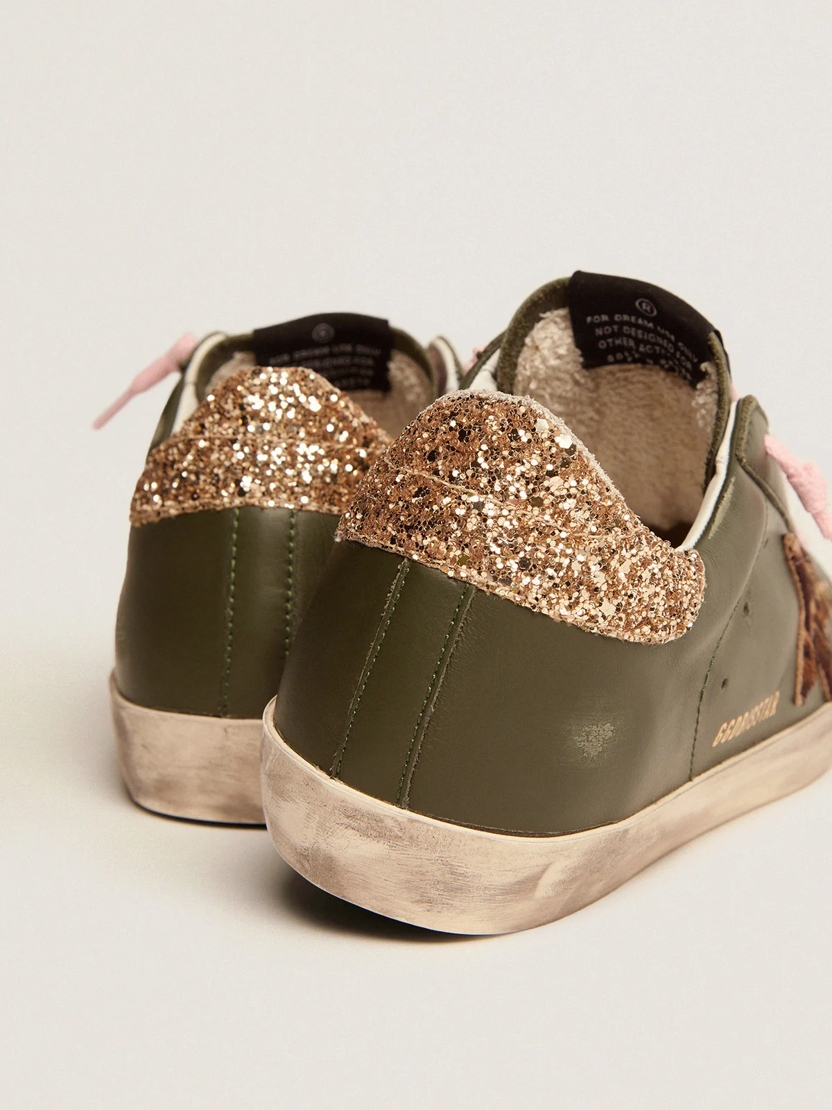 Baskets Superstar en cuir vert foncé avec languette arrière à paillettes dorées