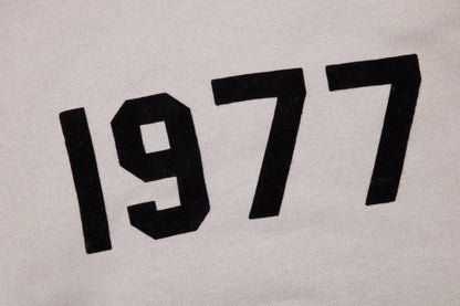 Sweat à capuche FEAR OF GOD ESSENTIALS « 1977 » gris pierre