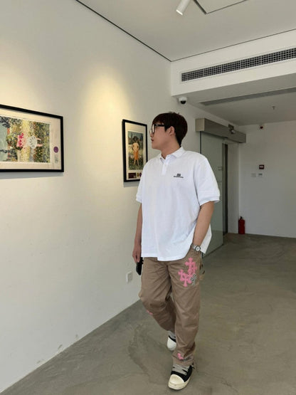 Polo blanc Balenciaga à logo BB