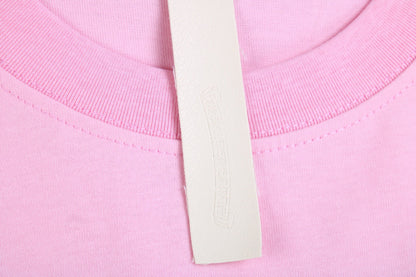 T-SHIRT ROSE AVEC LOGO DE FER À CHEVAL ET CŒURS CHROMÉS