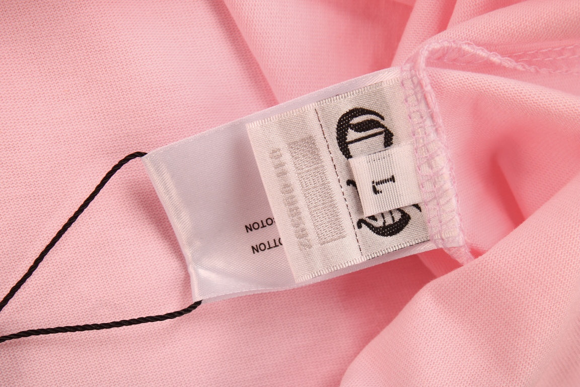 T-SHIRT ROSE AVEC LOGO DE FER À CHEVAL ET CŒURS CHROMÉS