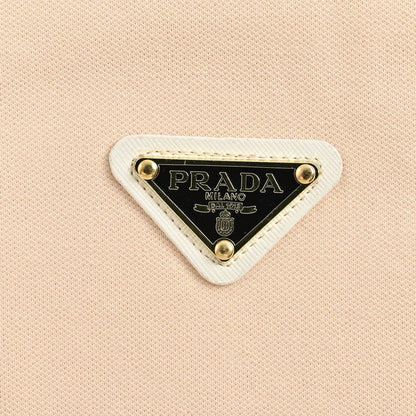 Polo beige à écusson logo Prada