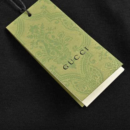 T-shirt noir Gucci à motif dinosaure rose