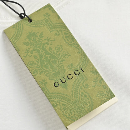 T-shirt blanc Gucci à motif dinosaure rose