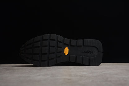 Baskets BAPE STA Retro Runner noires et blanches