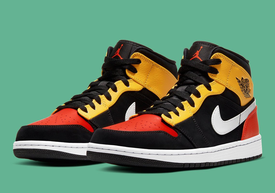 JORDAN 1 MID x NOIR AMARILLO ORANGE 
