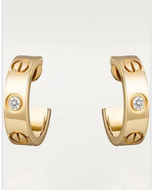 Petites boucles d'oreilles Cartier en or et diamants