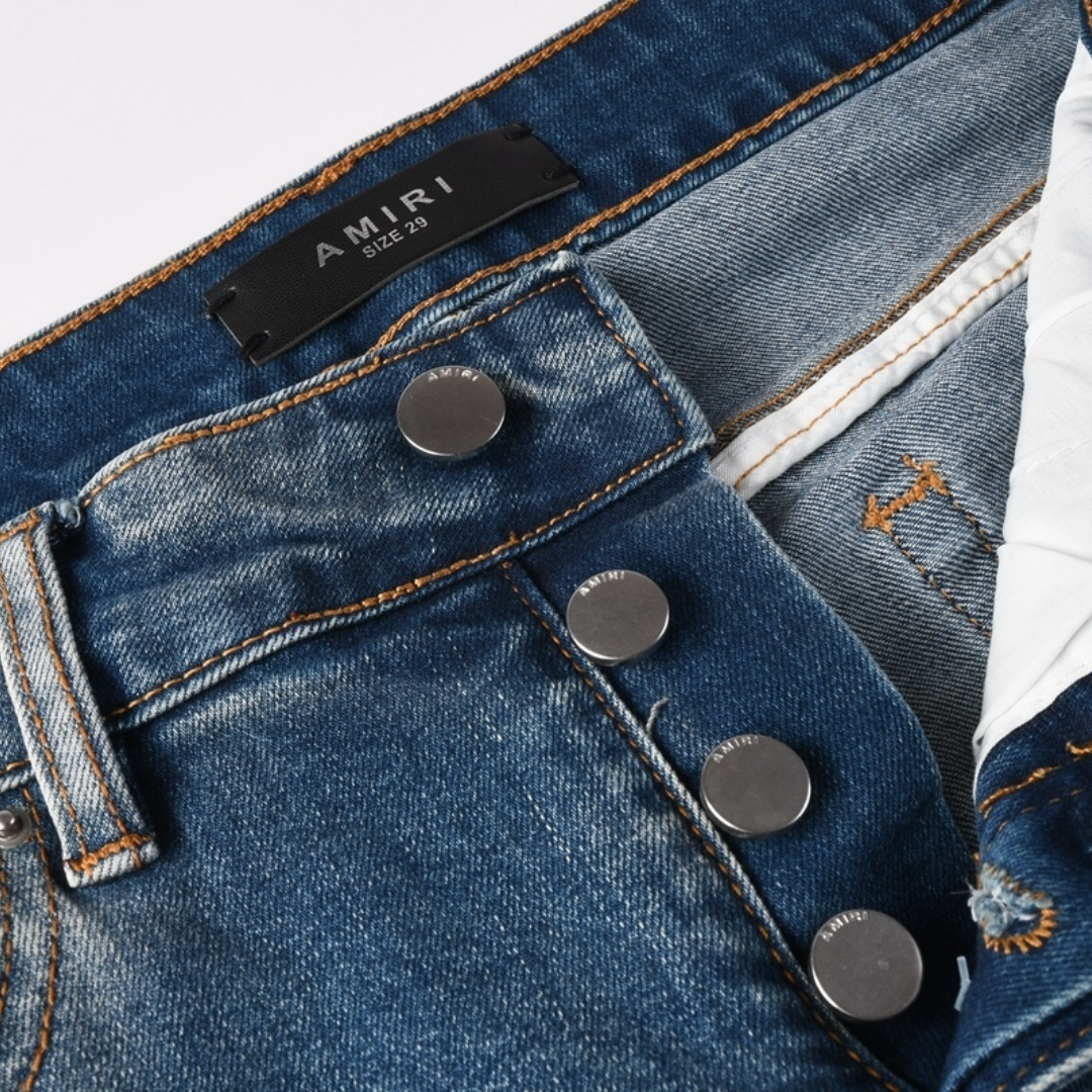 Jean déchiré à patch bleu Amr