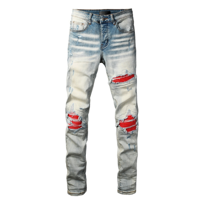 Jean déchiré à patch rouge Amr