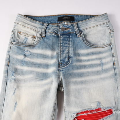 Jean déchiré à patch rouge Amr