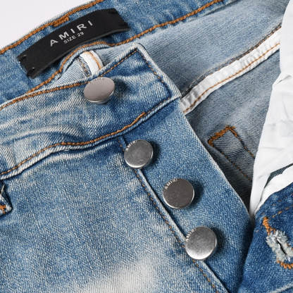 Jean déchiré à patch rouge Amr