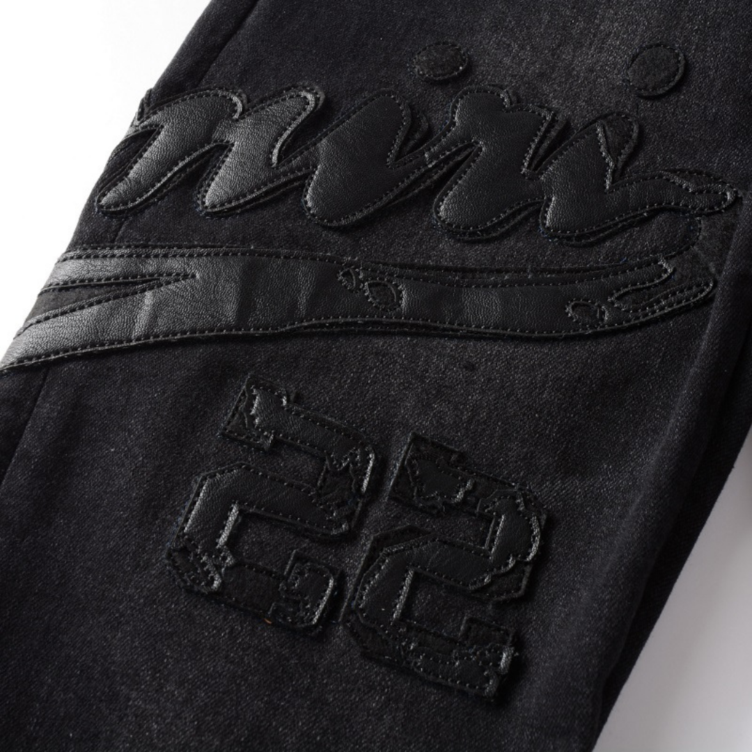 Jean Amr Triple Black Logo