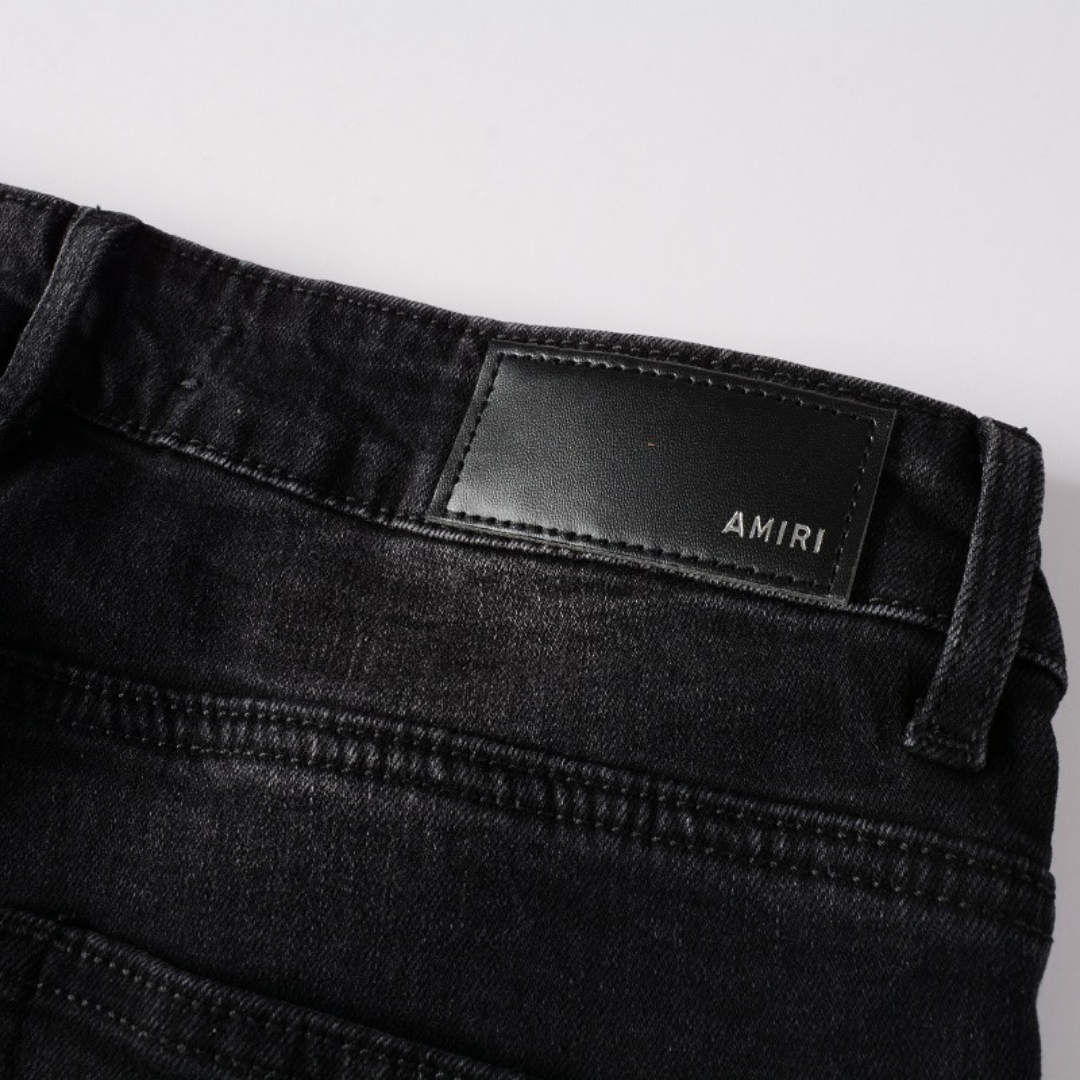 Jean Amr Triple Black Logo