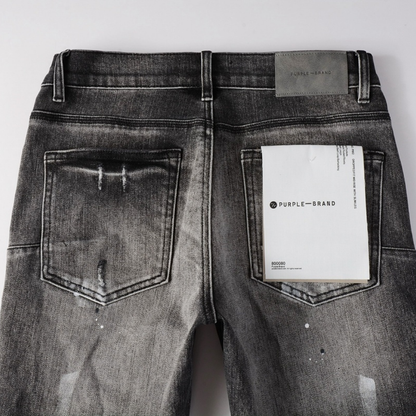 Jean déchiré à la peinture violette