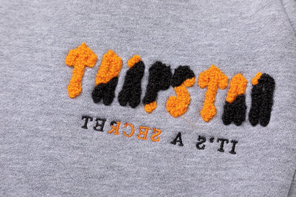 Survêtement gris orange décodé