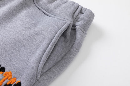 Survêtement gris orange décodé